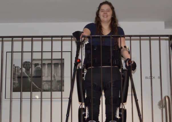Jennifer Smyth trials her new ReWalk exoskeleton, donated by Landmarc Support Services