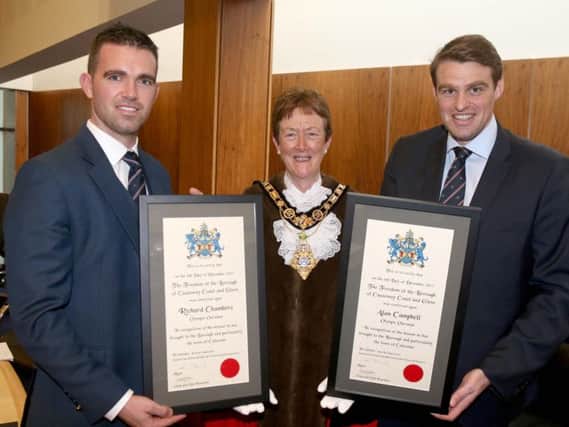 Richard Chambers and Alan Campbell Freemen of the Causeway Coast and Glens Borough Council look over their certificates with the Mayor Cllr Joan Baird. PICTURE KEVIN MCAULEY/MCAULEY MULTIMEDIA/CCGBC