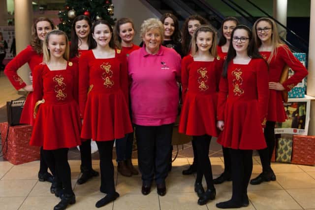 Irish Dance Group Innova seen here with Chairman of the Causeway Coast Dog Recue as they danced in front of shoppers to support the charity and raise awareness of the many dogs searching for their forever home at this time of year.