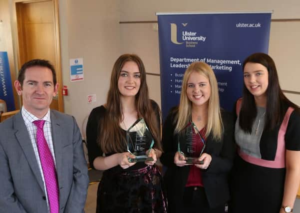 Rosaura Knox-Bradley, Hannah Cordner and Kathryn Kerr receive their awards from Dr Darryl Cummins.