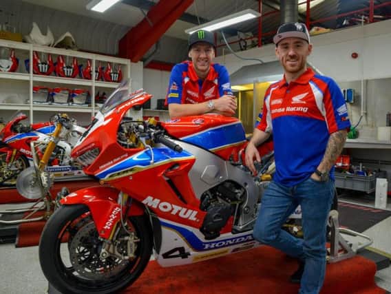 New signings Lee Johnston and Ian Hutchinson at Honda's headquarters in Louth.