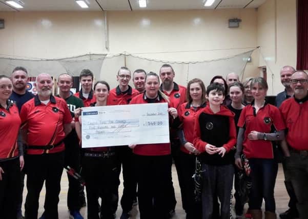Banbridge Archery Club members recently donated Â£540 to the Cancer Fund for Children thanks to a successful festive charity shoot.
