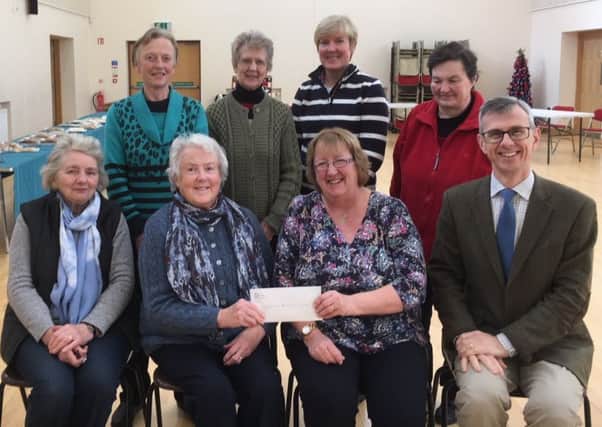 Members of Gracehill Country Market presenting donations to Rev Sarah Groves from Gracehill Moravian Church.