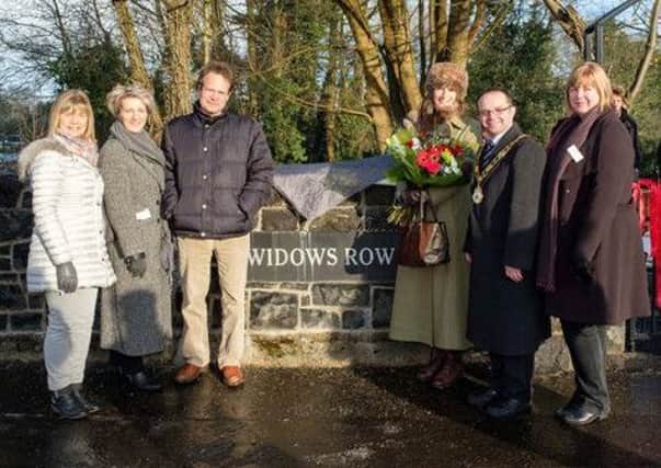 Shane & Celia O'Neill with The Mayor, Councillor Paul Hamill, Councillor Linda Clarke and members of Tidy Randalstown at the official opening of The Widows' Row