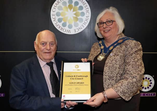 Alderman Tommy Jeffers, Chairman of the Council's Environmental Services Committee and Deputy Mayor, Councillor Hazel Legge with the Gold Award Workplace Charter in Domestic Violence which Lisburn & Castlereagh City Council was awarded.
