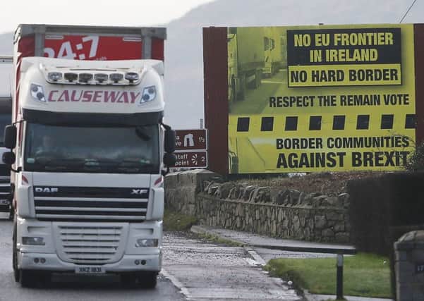 A truck passes a Brexit billboard in Jonesborough, Co. Armagh, on the northern side of the border between Northern Ireland and the Republic of Ireland, as Prime Minister Theresa May has said keeping the common travel area between the UK and Republic of Ireland will be a priority in EU divorce talks. PRESS ASSOCIATION Photo. Picture date: Tuesday January 17, 2017. See PA story POLITICS Brexit Ireland. Photo credit should read: Niall Carson/PA Wire
