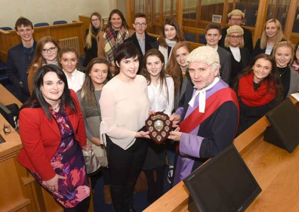 Shonagh Nelson accepts the winners trophy on behalf of the Ballymena Academy  team from His Honour Judge Babington, Recorder of Londonderry during the Mock Bar Trials at the Courthouse in Derry-Londonderry. Included is Dr Anne Rice from the Citizenship Foundation Picture Martin McKeown. Inpresspics.com. 09.12.17