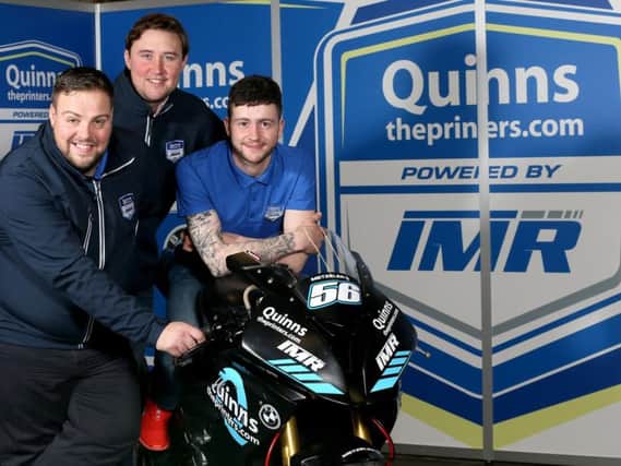 Adam McLean pictured with the new IMR/quinnstheprinters.com BMW S1000RR he will race on the roads in 2018. Looking on are team sponsor Peter Bradley, MD of quinnstheprinters.com with Ian Moffit, team principal of Team IMR.