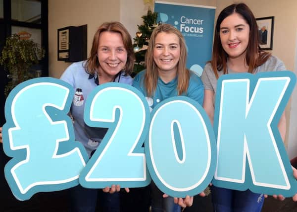From left, Karen Nixon (Irwin's Bakery), Rosie Forsythe (Cancer Focus NI) and Rachel Campbell (Irwin's Bakery) at the cheque presentation for Â£20,000.