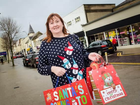 Ald Maureen Morrow is urging shoppers to shop local in Larne for last minute gifts.