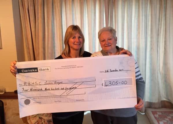Lucinda Kinnaird presented the cheque to Barbara Moneypenny, Chairperson of the Ladies League.