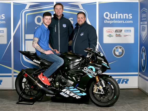 Adam McLean pictured with the new Team IMR BMW S1000RR he will race on the roads in 2018. Looking on are team sponsor Peter Bradley, MD of quinnstheprinters.com with Ian Moffit, team principal of IMR.