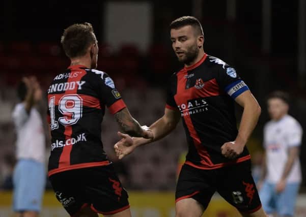 Crusaders Colin Coates  scores  against Ballymena