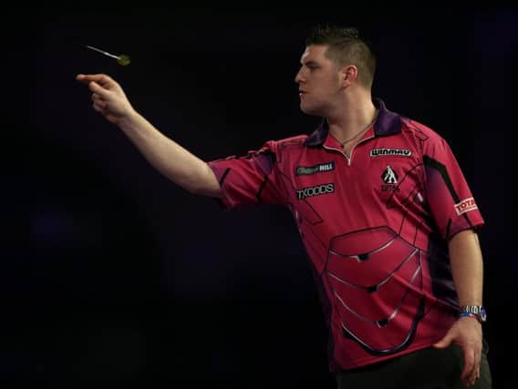 Daryl Gurney throws during Saturday's defeat to John Henderson