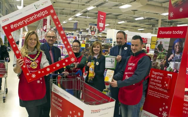 Deputy Mayor of Mid & East Antrim Borough Council, Cllr Cheryl Johnston, pictured supporting the Tesco Foodbank along with Cllr Timothy Gaston and Tesco staff, Ronny McFaul (Community Champion), Janice Colgan (Foodbank Co-ordinator), Paul Dowey (Grocery Line Manager) and Amy Johnston, (Fresh Lead Manager).
