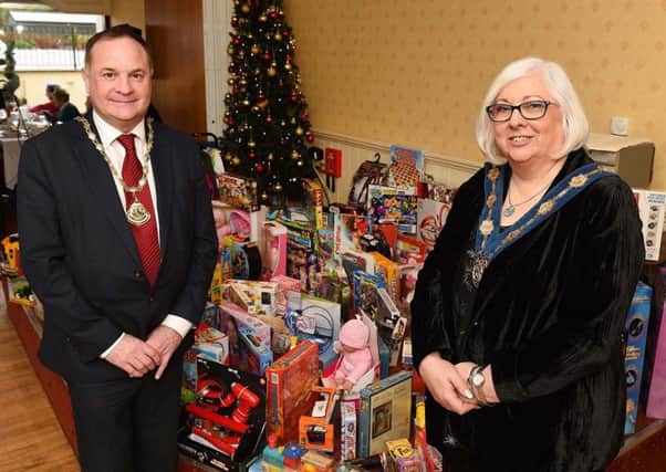 Chamber President Evan Morton and Deputy Mayor Hazel Legge with the huge collection of toys collected for Barnardo's.