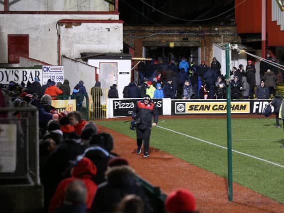 Fans file out of Solitude after last night's Premiership match between Cliftonville and Ballymena United was abandoned