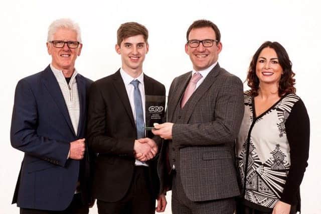 Sean Quinn, former student of Loreto College, receives his award for First Place in CCEA A Level Economics from CCEA CEO Justin Edwards, with teachers Mr Gerry McGouran and Mrs Stacey Mellon.