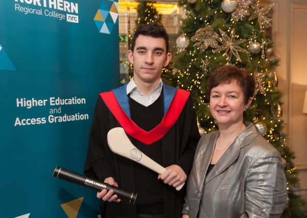 Northern Regional College student Emmet Martin from Randalstown pictured with his mother Siobhan at his recent graduation where he was awarded a HND Diploma in Business.