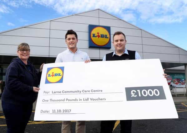 Presenting a Â£1000 'Charity of the Week' cheque to Larne Community Care Centre representative Lucinda McFall is Larne Lidl Area Manager Scott Martin with Deputy Store Manger Jonny and. Pic: Press Eye.