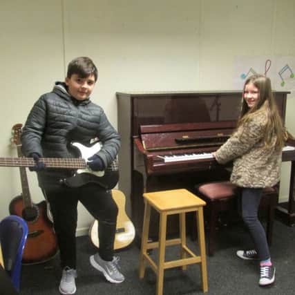 Having a try with some instruments in the Music Department.