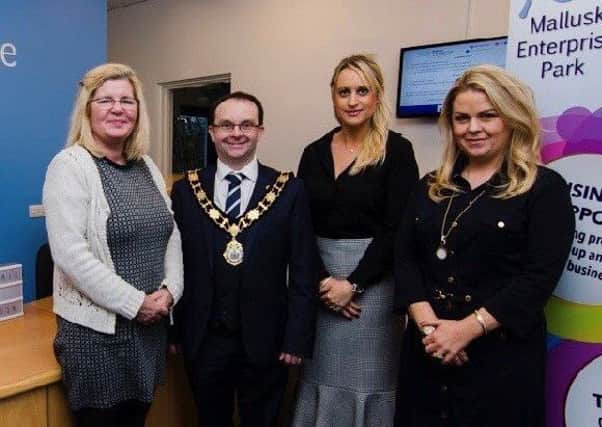 Cllr Paul Hamill pictured with staff at Mallusk Enterprise Park.