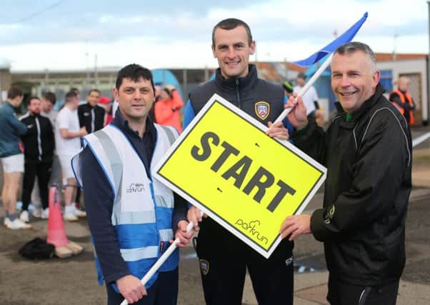 Coleraine FC manager Oran Kearney starts the park run. Included are Colin Rice, run organiser, and Gary Milling, Governor, Magilligan Prison.


Mandatory Credit Â©Lorcan Doherty