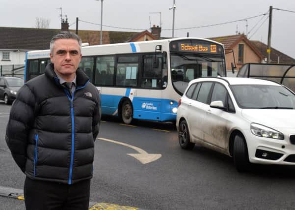 St Teresa's Primary School principal, Eunan Kearney pictured in the school carpark where the school bus has difficulty getting parked at times due to parents taking up the designated bus space. INLM02-201.