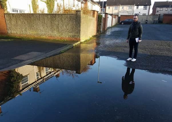 Ciaran Toman from Upper Bann SDLP surveys an area of Monbrief Walk in Lurgan which has flooded