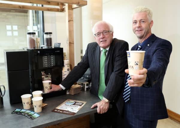Alderman Allan Ewart MBE (left), Chairman of the Lisburn and Castlereagh Fairtrade Steering Group, and Dr Chris Stange, Secretariat of the All Party Fairtrade Group at Stormont promoting the Fairtrade products available at the Coffee Dock in Lagan Valley Island.