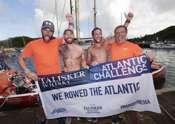 Alistair Cooper, Luke Baker, Gareth Barton and George McAlpin celebrate as they become the fastest Northern Irishmen in history to row across the Atlantic