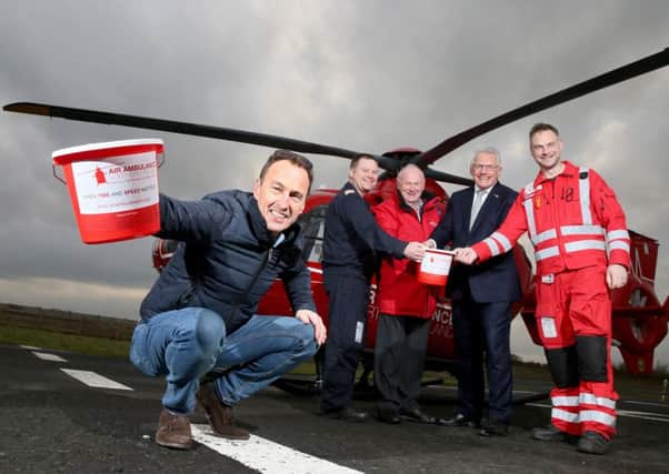 Former Vauxhall International North West 200 race winner, Jeremy McWilliams joins Event Director, Mervyn Whyte and Air Ambulance NI Chairman, Ian Crowe to announce the  selection of AANI as the race festival's chosen charity for 2018. Also included are pilot, Richard Steele and Paramedic, Stuart Stevenson.