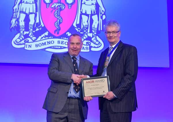 Dr Peter Maguire receives his Award from the President of the Association of Anaesthetists of Great Britain and Ireland, Dr Paul Clyburn