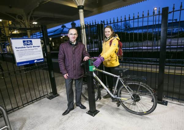 Pictured unveiling the new secure cycle parking compound at Lisburn Train Station are Translink's Gary Dunlop and Claire McLernon from Sustrans.