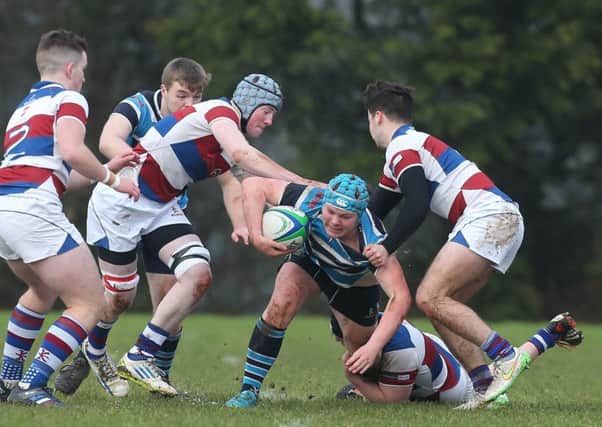 Dromore's Aaron Lyttle in action with Dalriada's M Kennedy