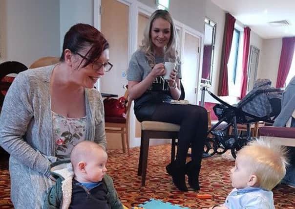 Babies Harry and Aodhan, with mums Kara-Leigh and Vidette, enjoying the launch of the Baby and Me group.