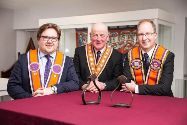 Pictured with the Royal stirrups which will go on display at the Orange heritage centre in Limavady are Edward Stevenson, Grand Master of the Grand Orange Lodge (centre) and trustees Aaron Callan (left) and Keith Thompson.