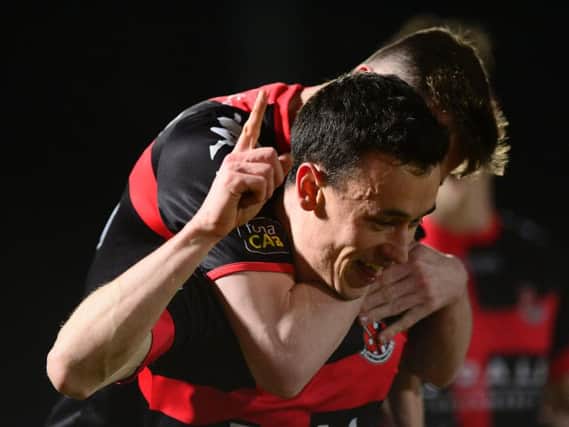 Crusaders' Paul Heatley celebrates his goal in Tuesday night's County Antrim Shield final