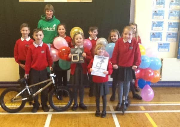 Cairncastle Primary school council pictured receiving the Sustrans Silver Award which has been awarded to the school. (Submitted Picture).