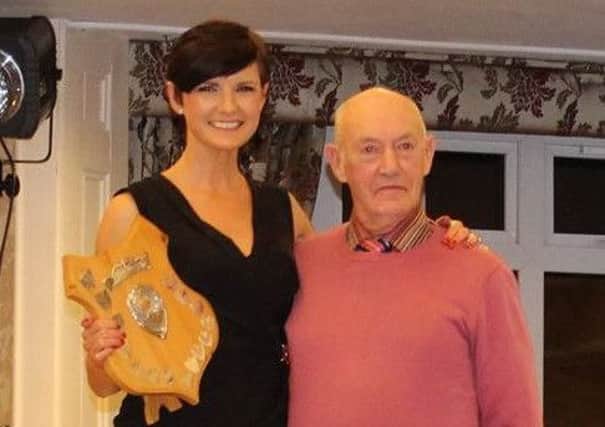 Ciara Toner receives the athlete of the year awards from Springwell RC President Jim Reid