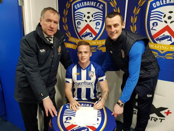 Aaron Burns is welcomed to Coleraine by manager Oran Kearney and Chairman Colin McKendry.