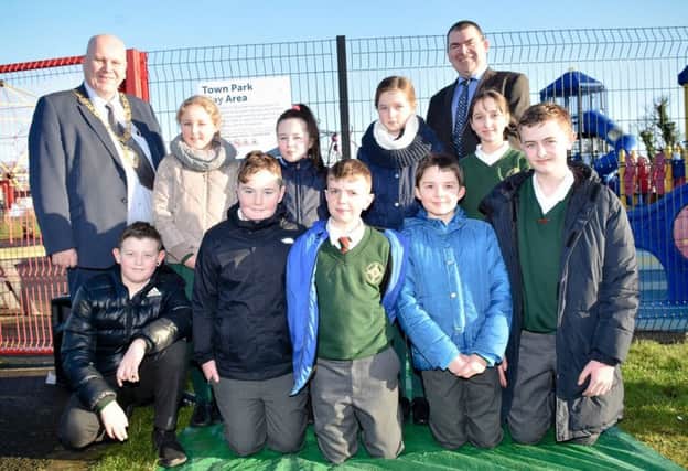 Mayor of Mid and East Antrim, Cllr Paul Reid with Maurice Meehan, PHA Head of Health and Social Wellbeing Improvement for the Northern Area and P7 pupils from St MacNissis Primary School, Larne.