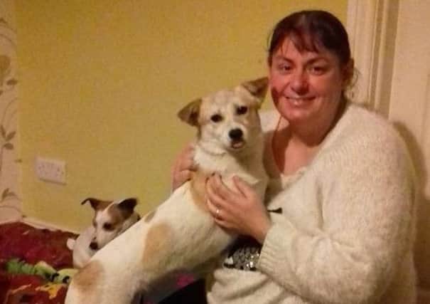 Michelle Murphy with her adopted dog Dee Dee, who was rescued from the meat trade in China.