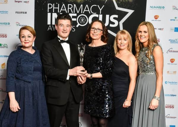Brian Morgan, Director of UK and Ireland Business, KISS Cosmetics with the winning team from Boots, Ballyclare.