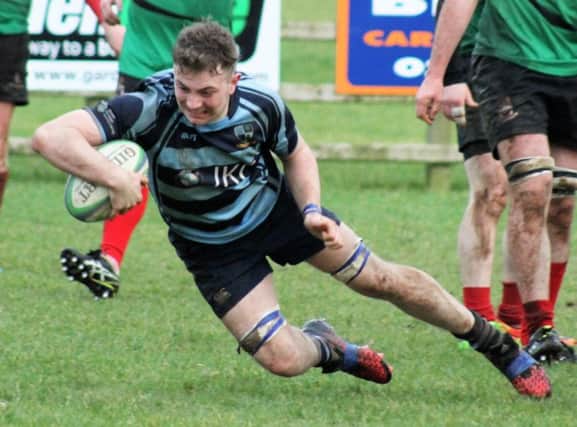 Ballymoney wing forward, Adam Stevenson, scores beside the posts in the Kukri Q2 League match with the PSNI. Photo by Uel McDowell.