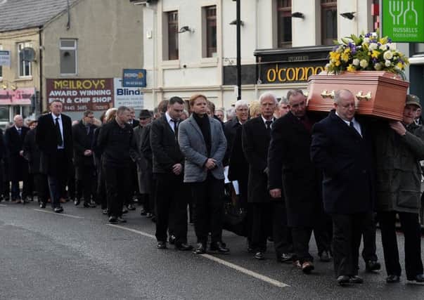 Family and friends at the funeral of Robert Flowerday in Crumlin