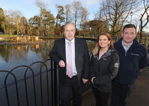 Alderman James Tinsley, Chair of the council's Leisure and Community Development Committee, with Biodiversity Officer Tracey Connolly and Stephen Mackle, Grounds Maintenance Officer, at the refurbished duck pond in Wallace Park, Lisburn.