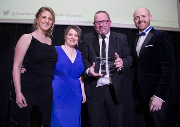 The Alastair Scott Ceilidh Band have been crowned Northern Ireland
Wedding Entertainer of the Year 2018. Pictured here are members Ruth, Amanda (Larne), and Kenny picking up their accolade from Barra Best.