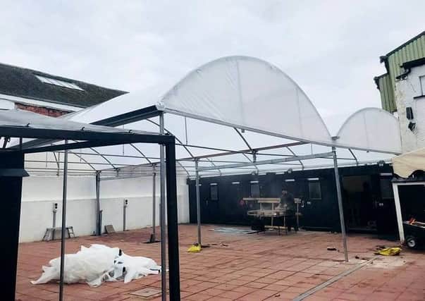 Work continuing to erect the roof at Penny Square ahead of the relaunch of the city centre site as an events venue and indoor market.