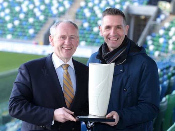Paul McLean of BetMcLean with Crusaders manager Stephen Baxter.